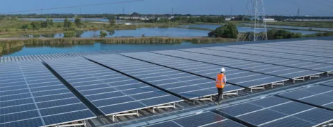 Engineers check and install solar panels