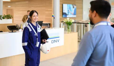 Synergi Life users and colleagues talk in DNV office