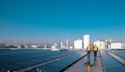 Two workers on a solar plant