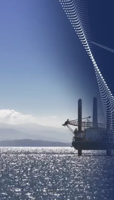 Oil rig and wind farm in a blue ocean with clear blue sky in the background with an animated drawn white transformation graphic