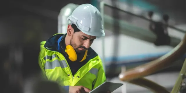 worker in hard hat and high vis jacket